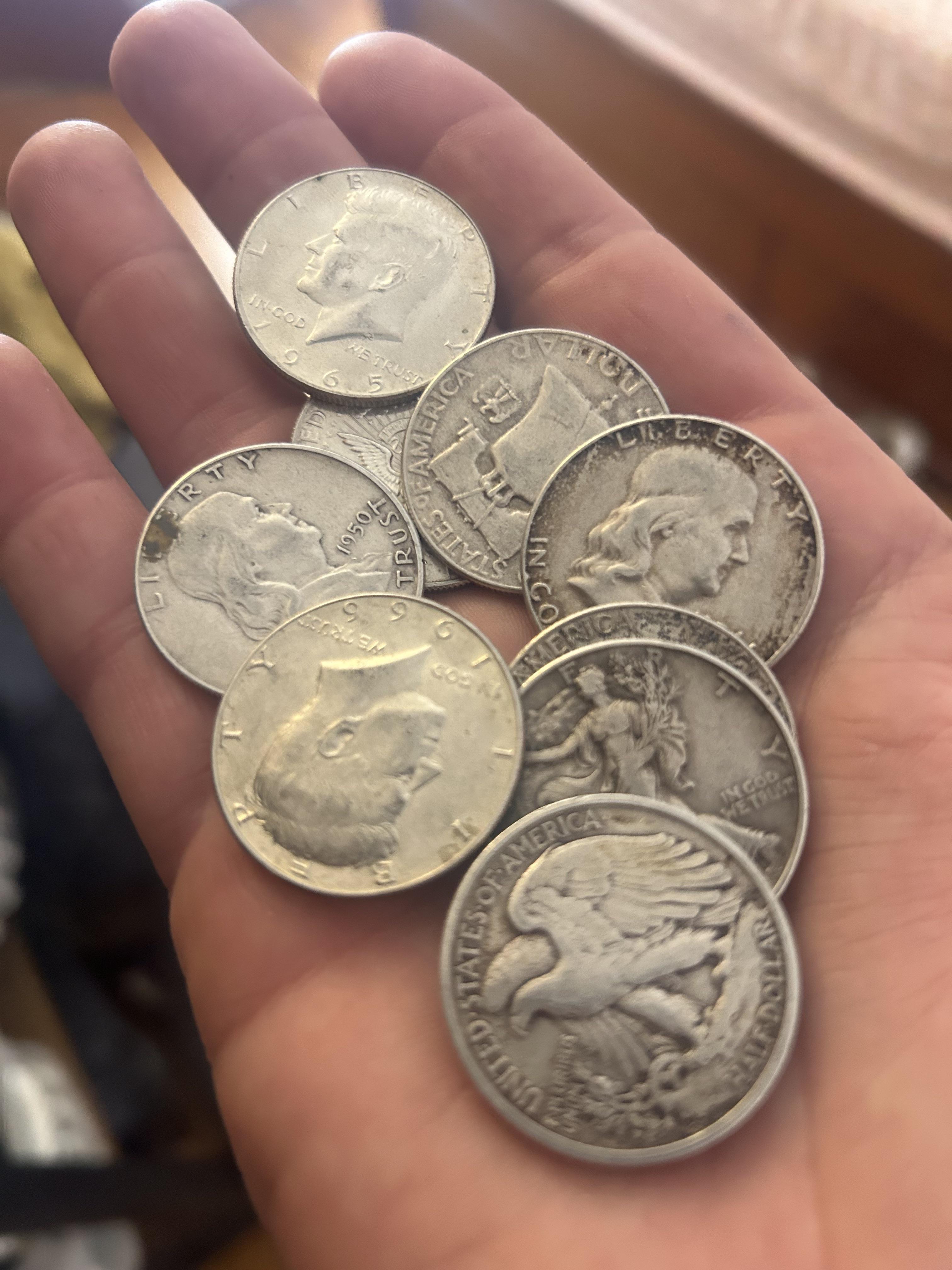 Silver coins in hand